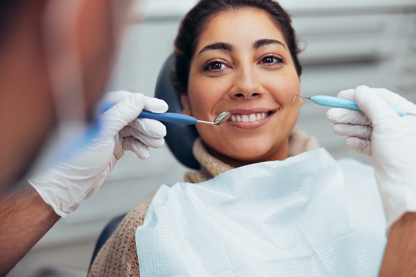 dental hygienist cleaning teeth